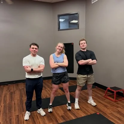 Members smiling together at E’ville Fitness
