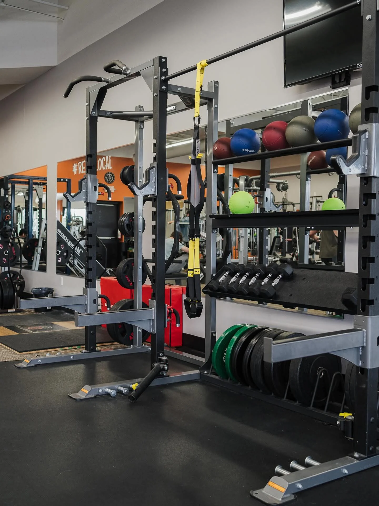 Loaded barbell on the strength floor at E’ville Fitness